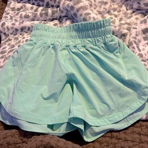 Size 0, 4-inch hotty hots- tag from inside torn off, never worn (color is teal)